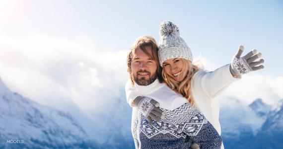 couple on mountain in winter